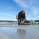 Jon Larsen searching for samples on a roof. (Courtesy of Jon Larsen)